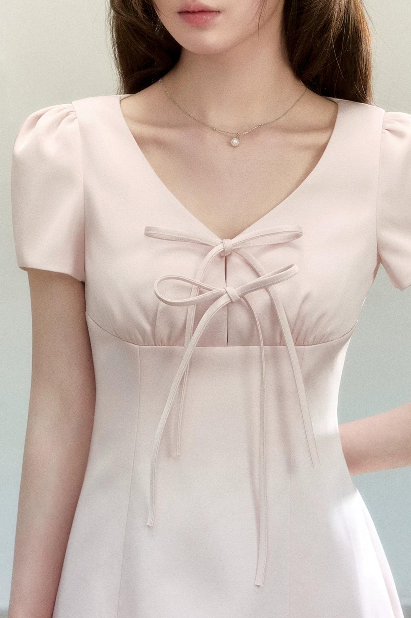 Abito elegante a trapezio con fiocco