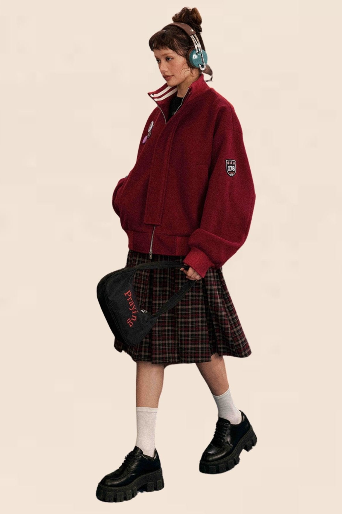 Jupe plissée à carreaux noirs et rouges