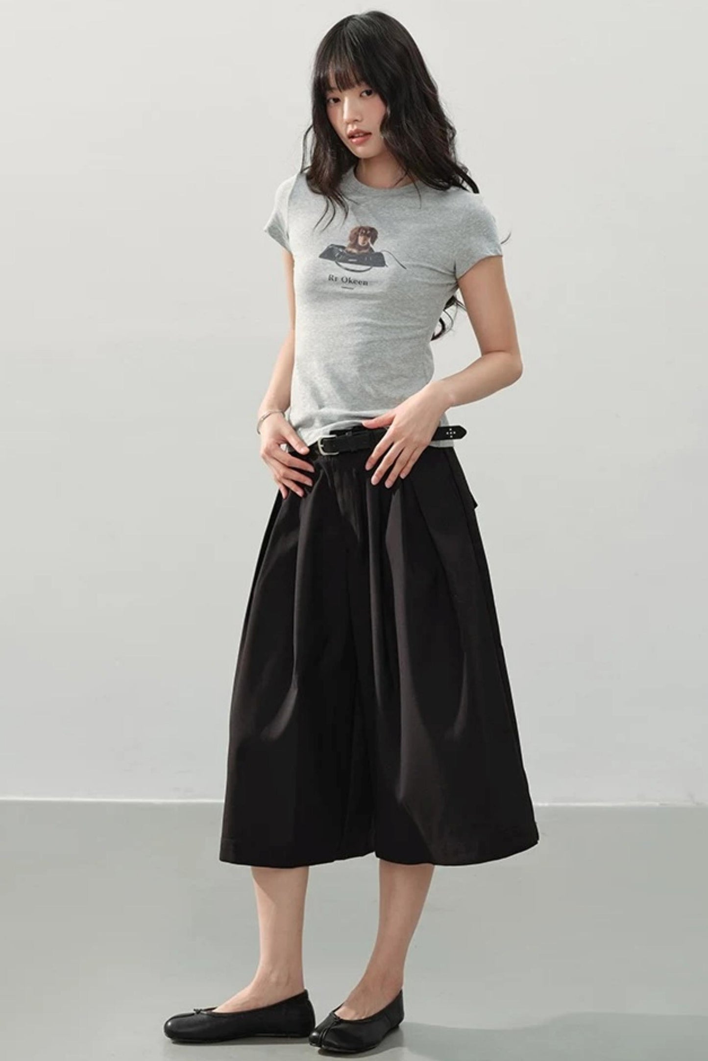 Pantaloni neri drappeggiati a gamba larga