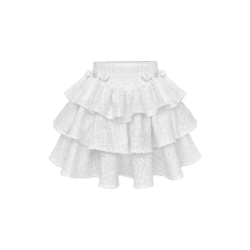 Jupe en tweed à paillettes avec nœud perlé