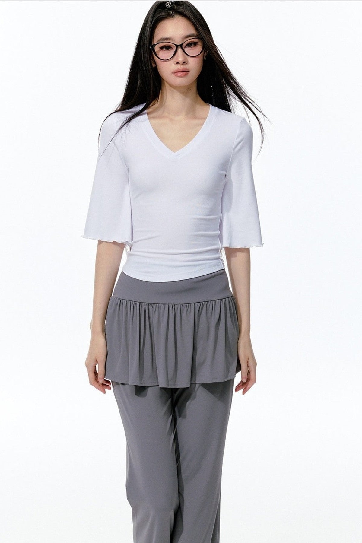 Completo rosa con top a maniche a campana e pantaloni da yoga