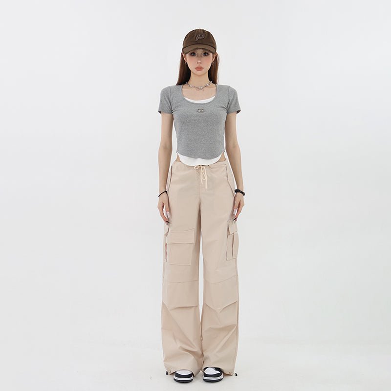 Pants with waist adjustment hem drawcord