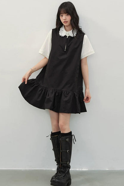 Vestido negro con cremallera y bajo con volantes