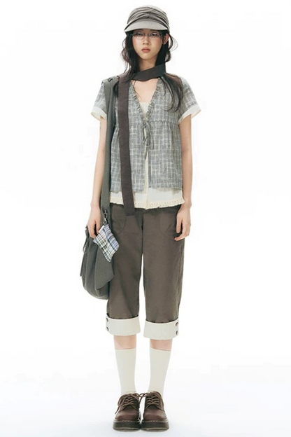 Camicia a quadri con volant e scollo a V