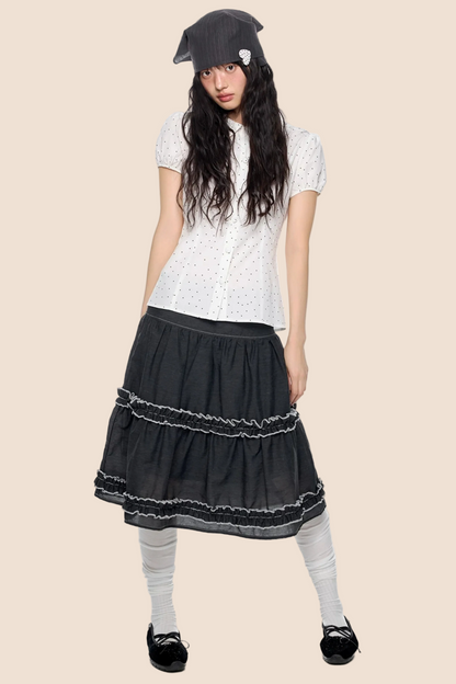 Blusa a pois con maniche a sbuffo