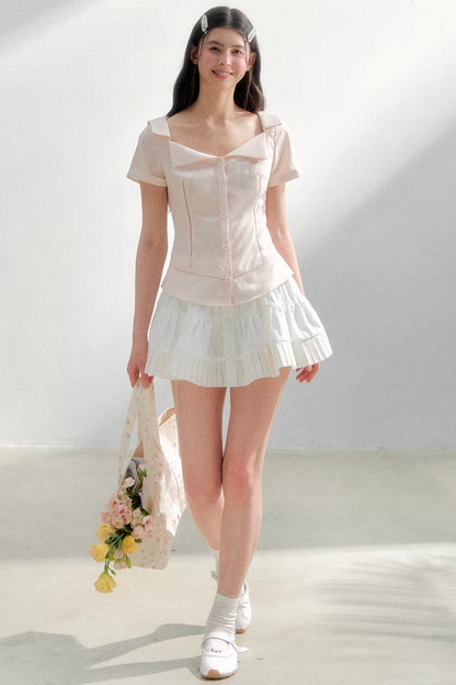 Blusa retrò rosa con risvolto