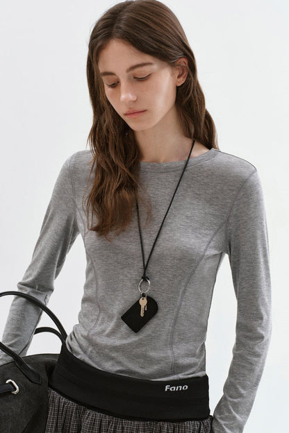 Haut polyvalent à manches longues et coupe slim