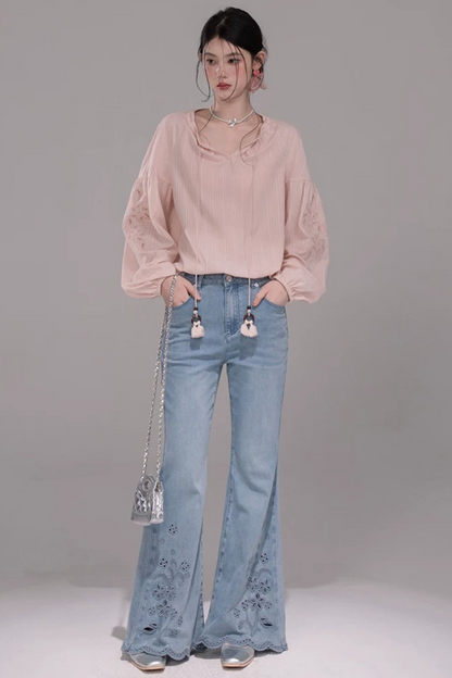 Pantaloni in denim lavato con ricamo laser