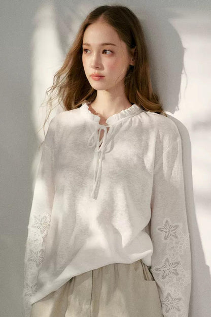 Hollow Floral Tie-Up Blouse