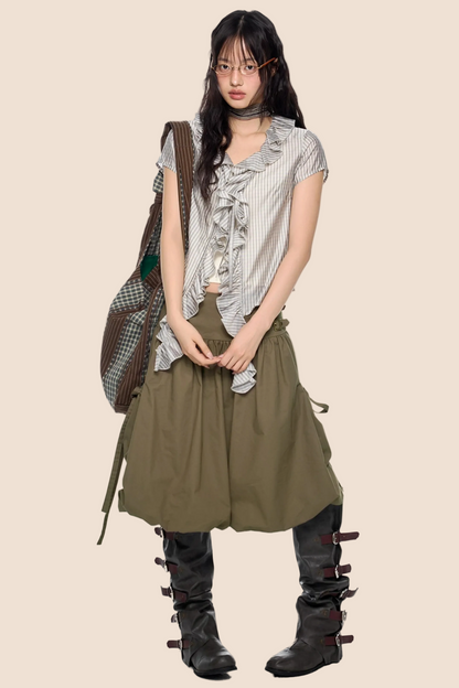 Blusa a quadri con pizzo e scollo a V