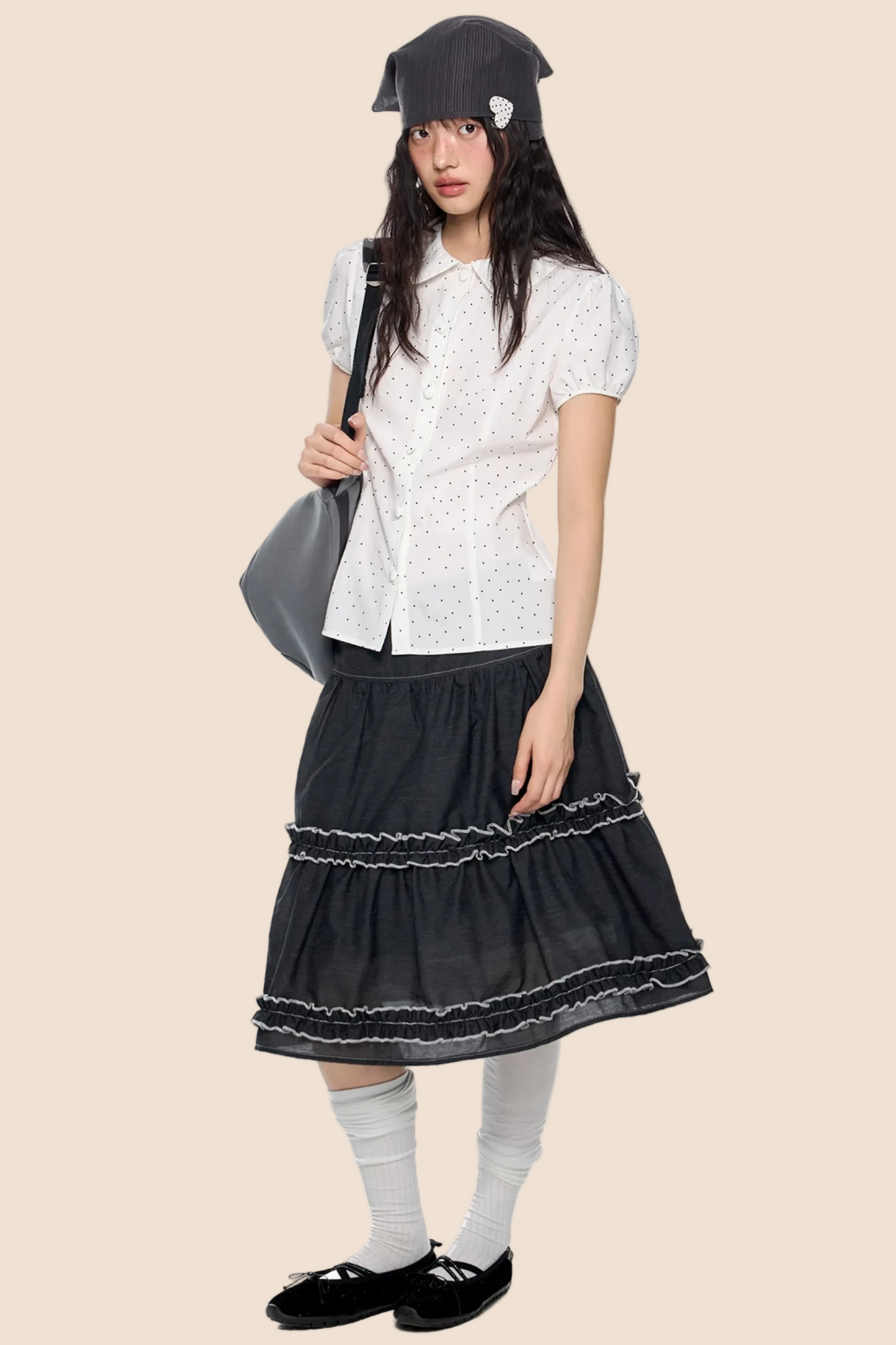 Blusa a pois con maniche a sbuffo