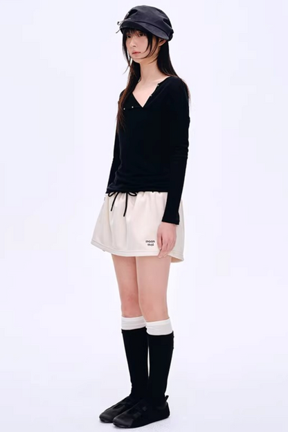 Blusa asimmetrica in misto lana