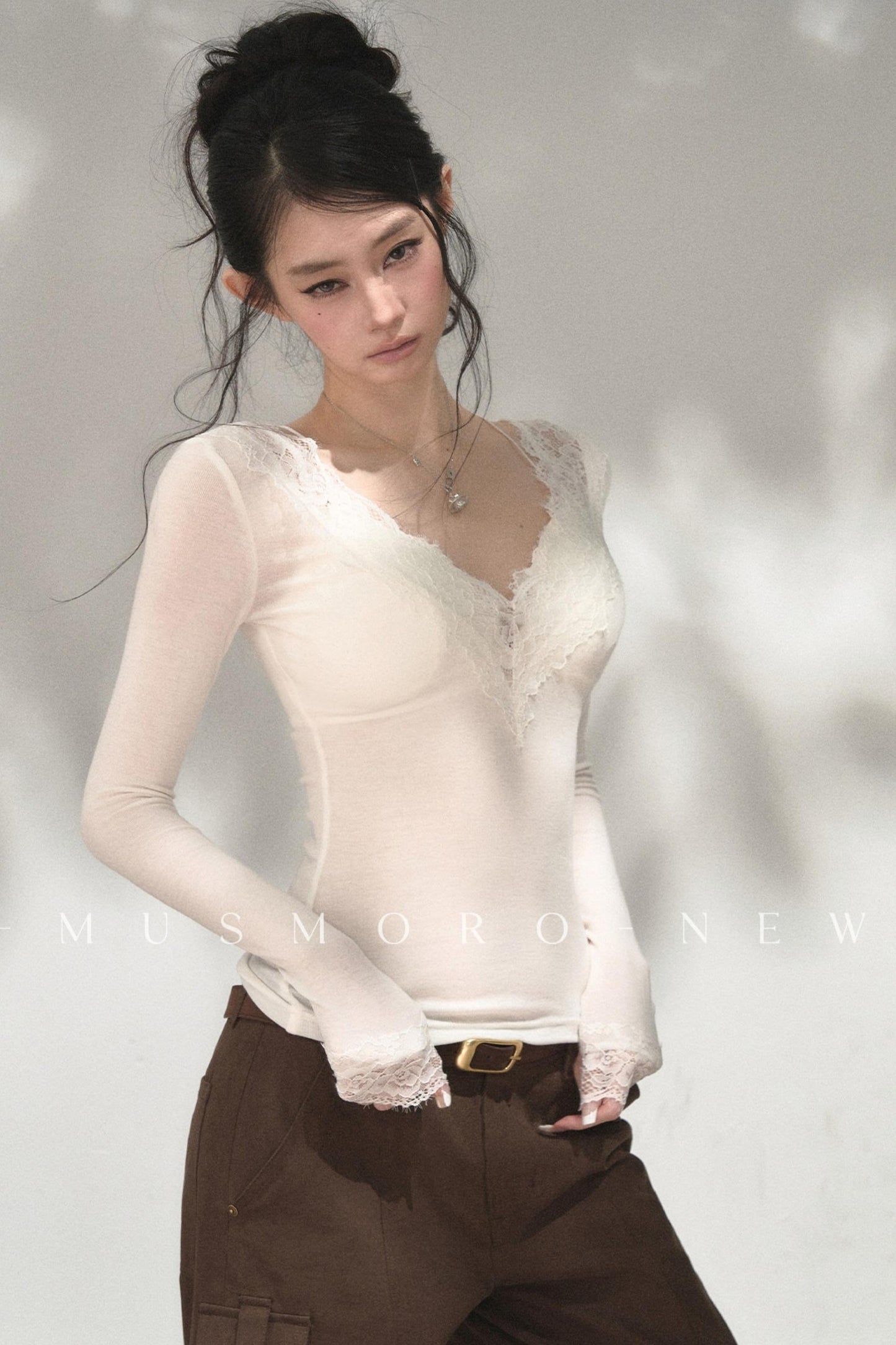 Top in maglia di pizzo a toppe
