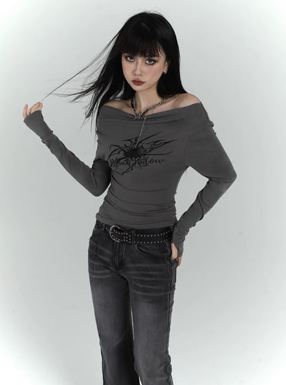 figure-showing one-shoulder long-sleeved top