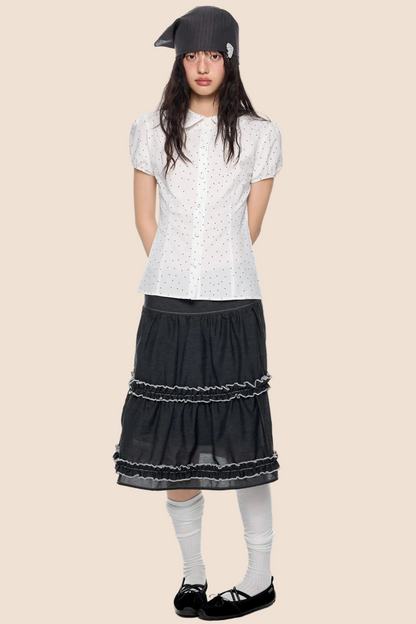 Blusa a pois con maniche a sbuffo