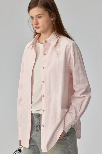 Blusa a rayas con textura y hombros caídos