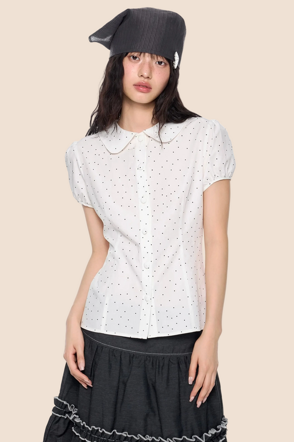 Blusa de lunares con mangas abullonadas
