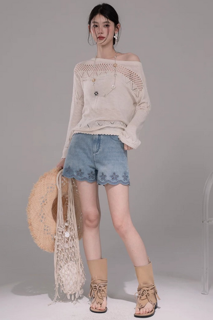 Pantaloni in denim lavato con ricamo laser