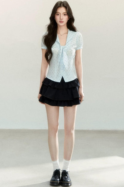 Blusa a pois con collo a fiocco