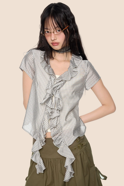 Blusa a quadri con pizzo e scollo a V