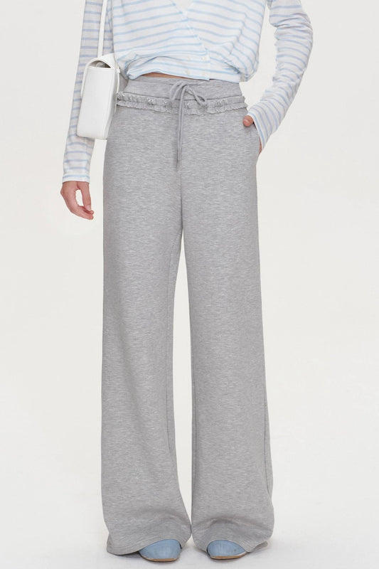 Pantalones rectos con volante, cintura elástica y cordón