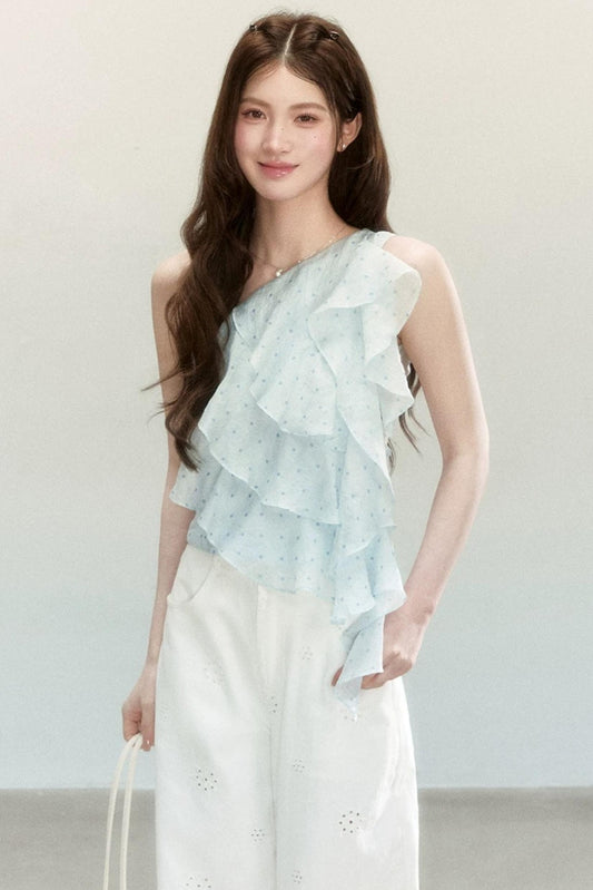 Blusa a pois in tessuto leggero con volant