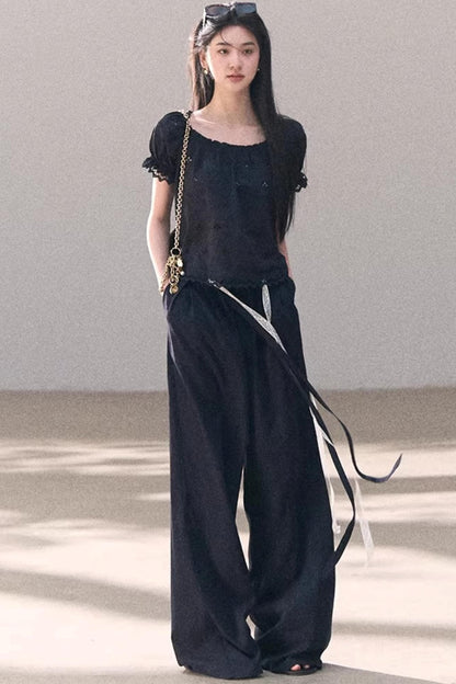 Pantalones de lino y lyocell con encaje