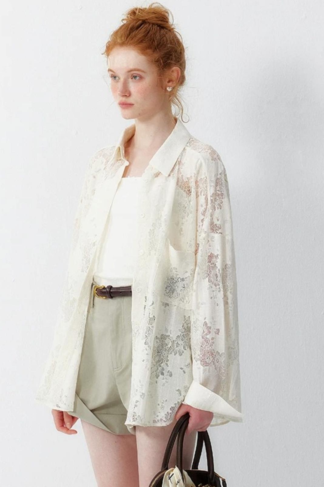 Blusa floreale in pizzo bianco sporco