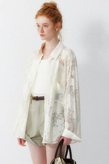 Blusa floreale in pizzo bianco sporco