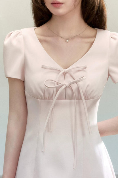 Abito elegante a trapezio con fiocco