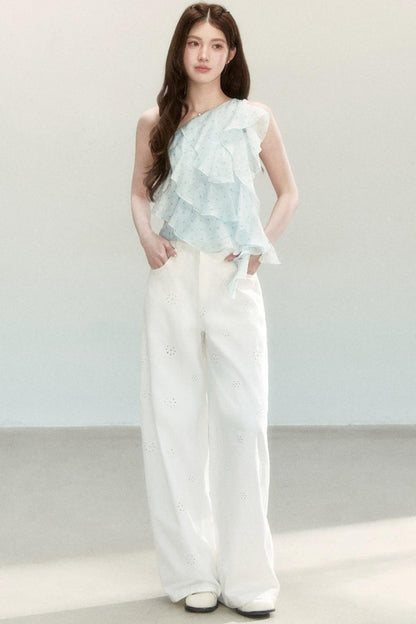 Blusa a pois in tessuto leggero con volant