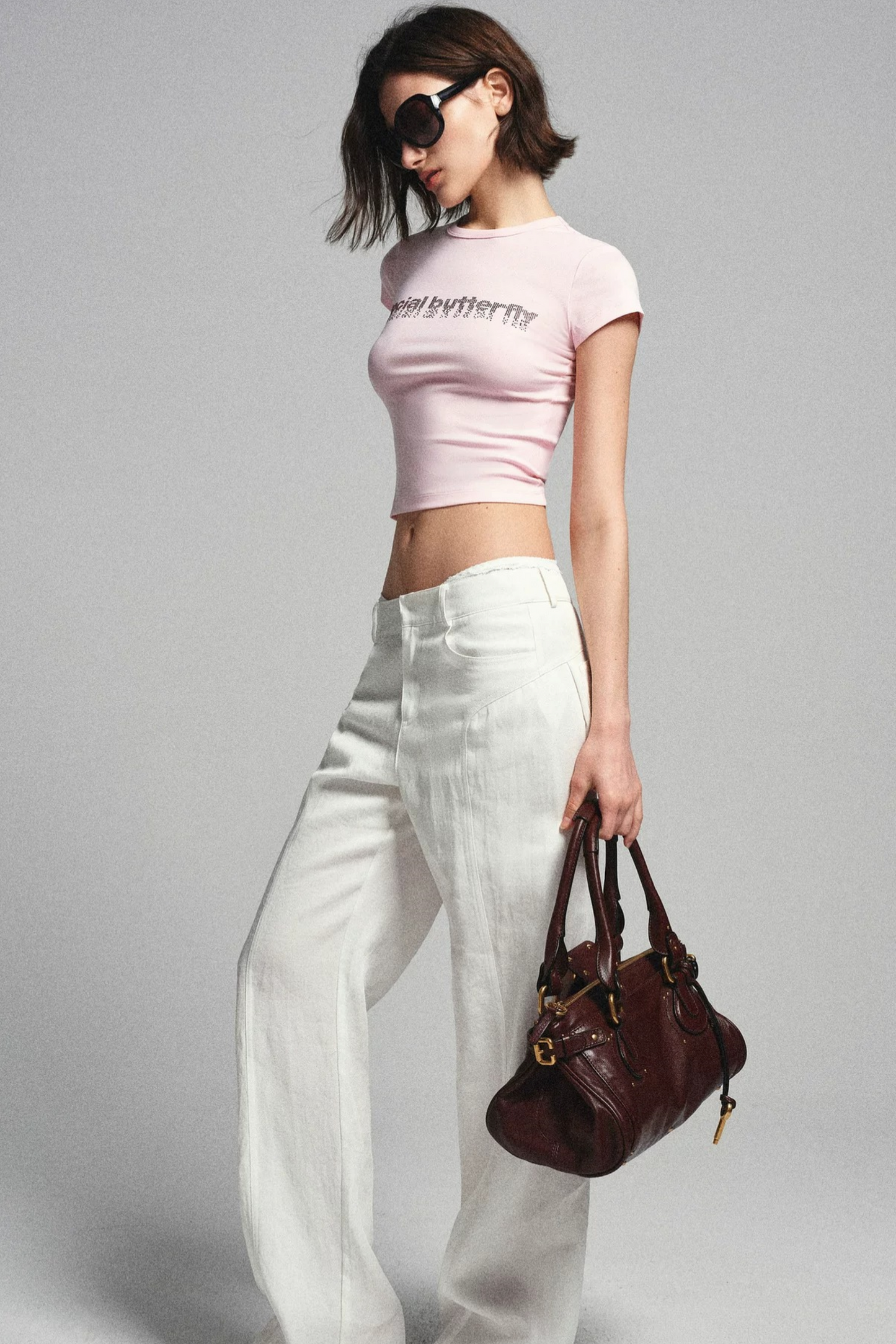 Maglia narrativa rosa con strass