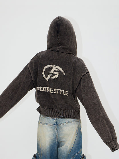 Strickte gewaschene, gestickte Jacke, die gewaschen wurde