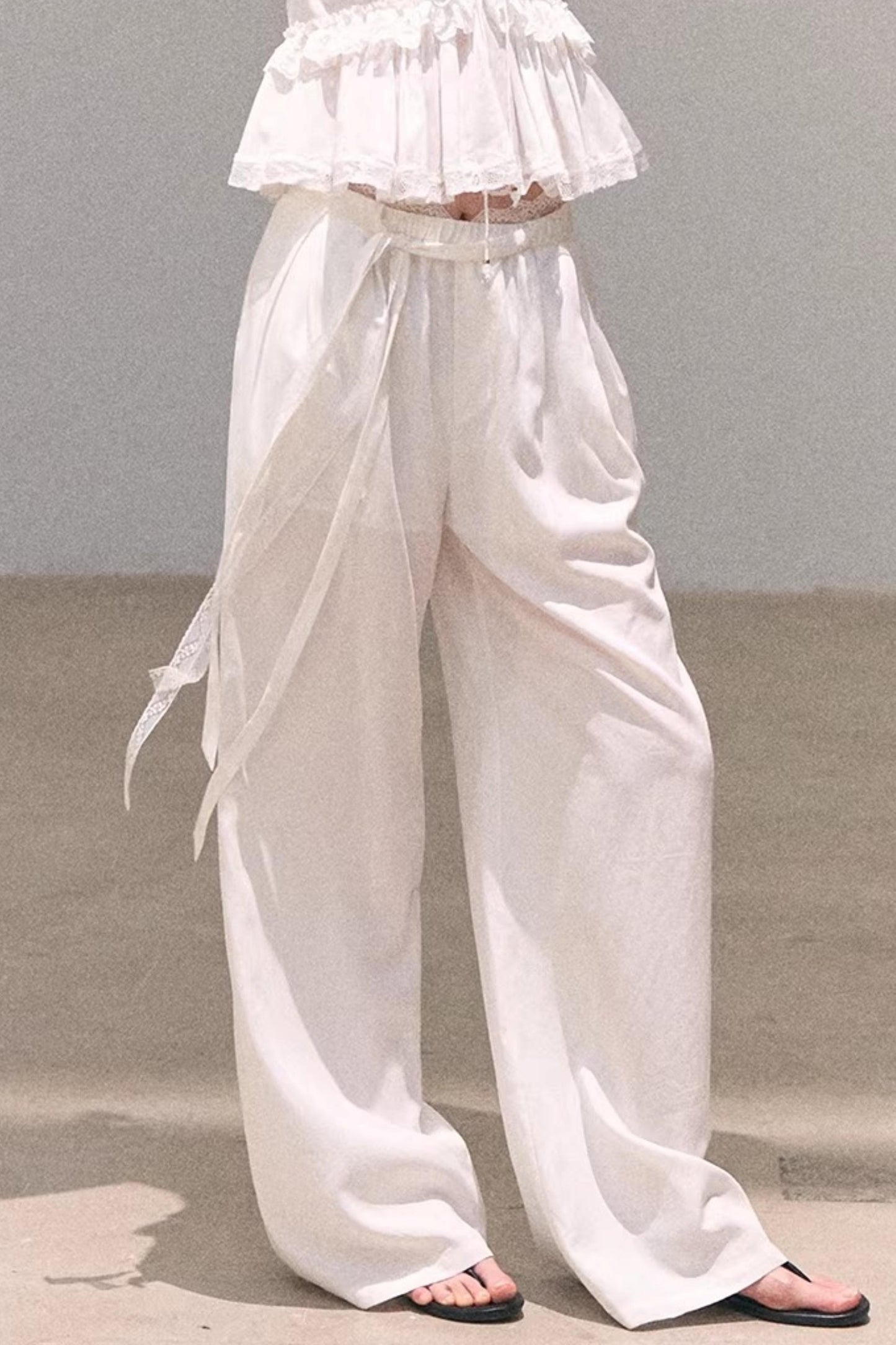 Pantalones de lino y lyocell con encaje