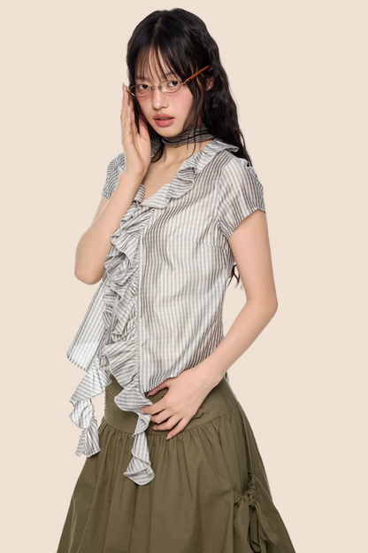 Blusa a quadri con pizzo e scollo a V