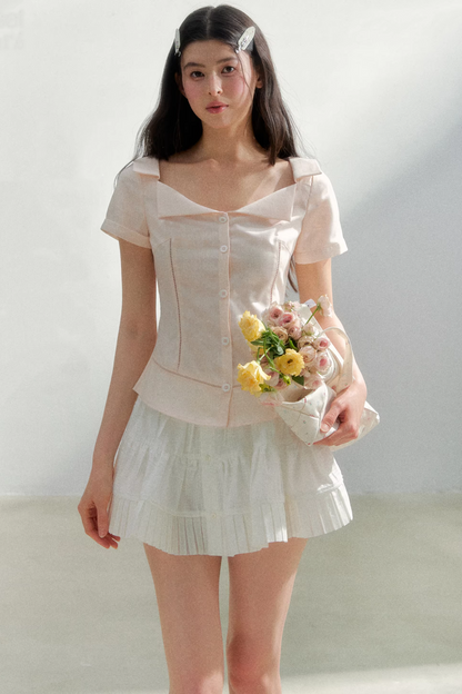 Blusa retrò rosa con risvolto
