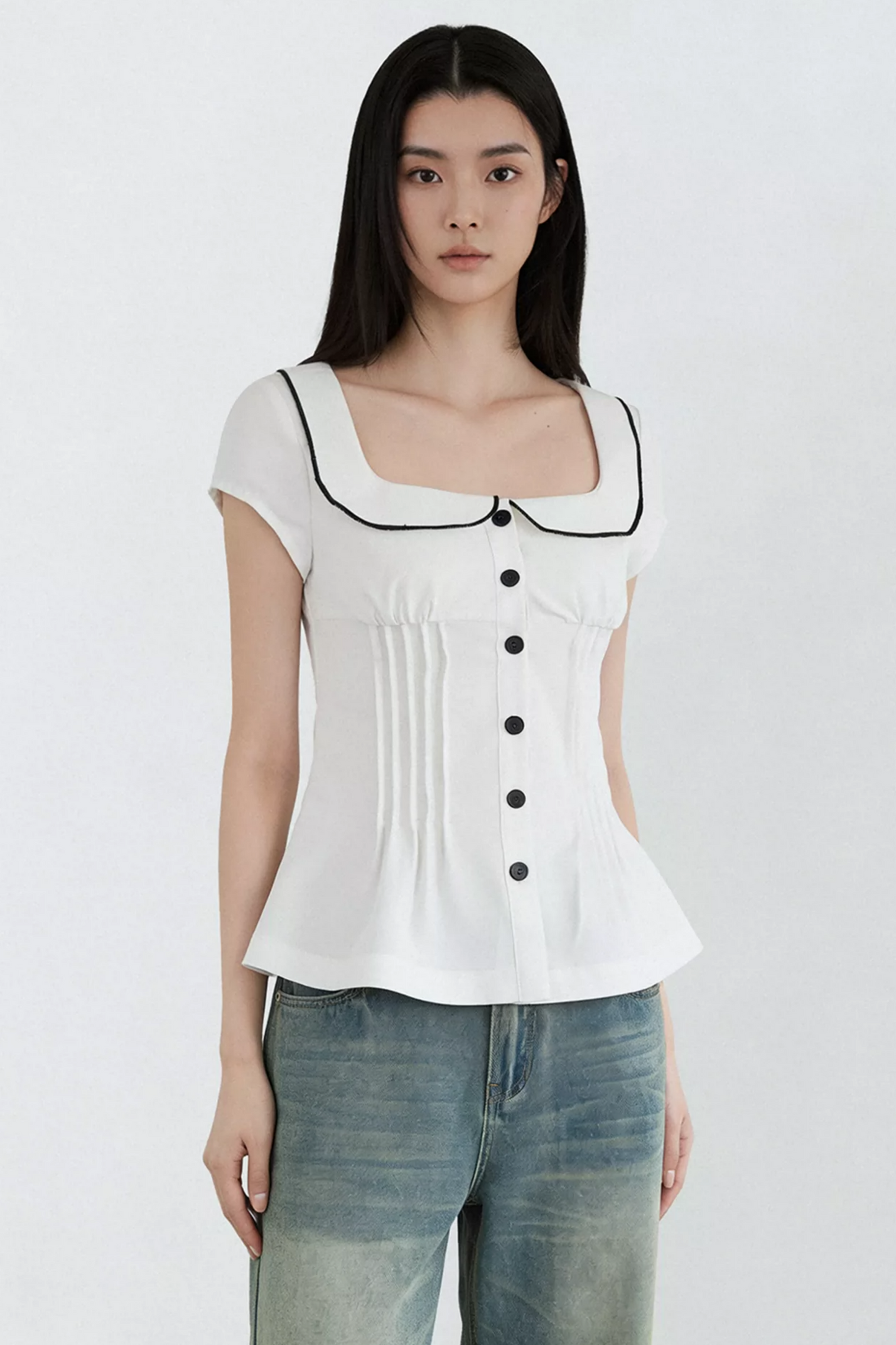 Blusa con cuello de muñeca con bloques de color