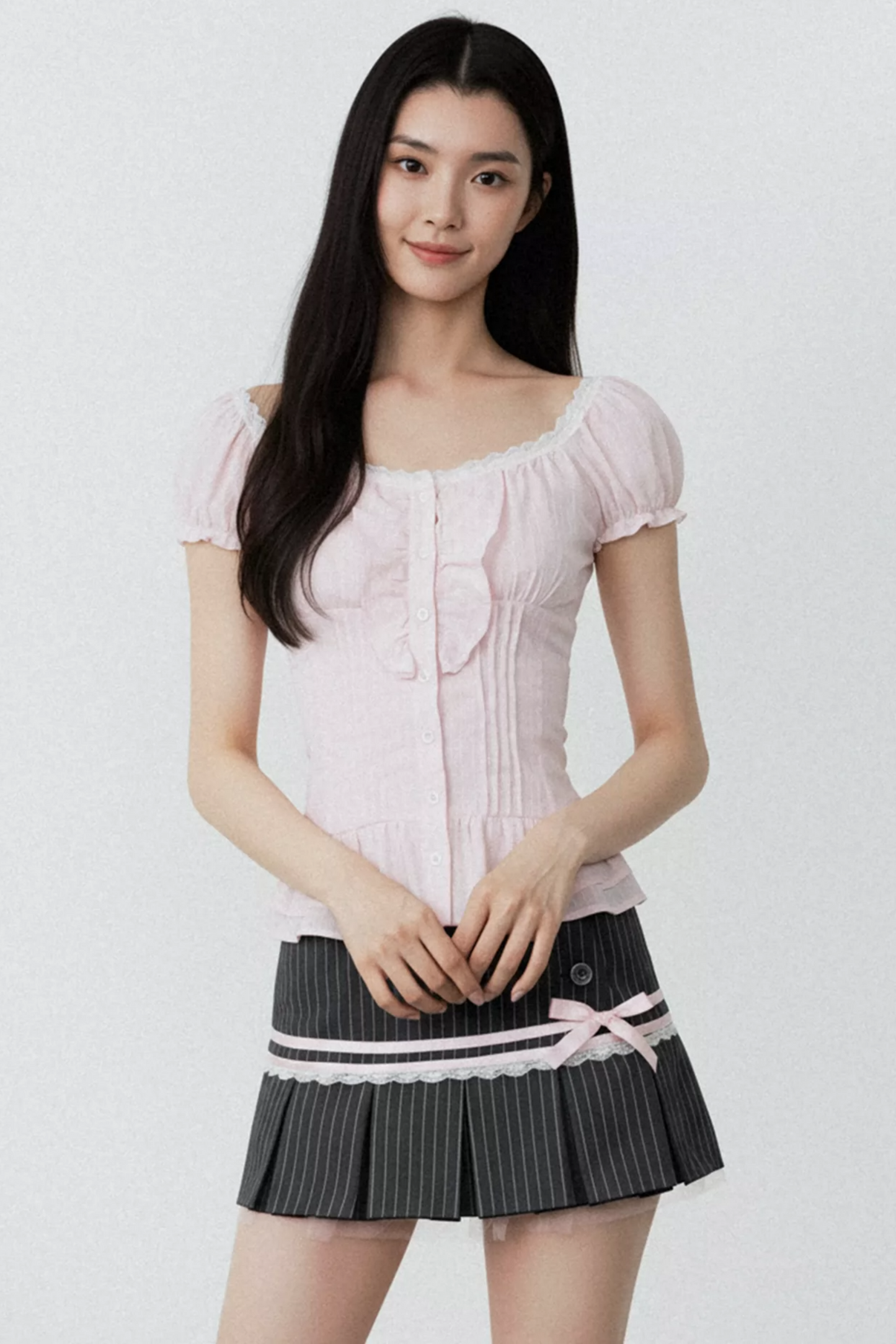 Conjunto de blusa con volantes rosa puro