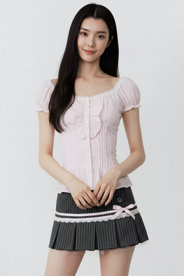 Conjunto de blusa con volantes rosa puro
