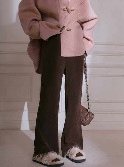 Cut-out raw knitted flared trousers