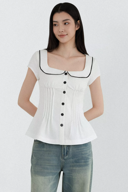 Blusa con cuello de muñeca con bloques de color