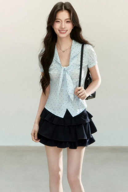 Blusa a pois con collo a fiocco