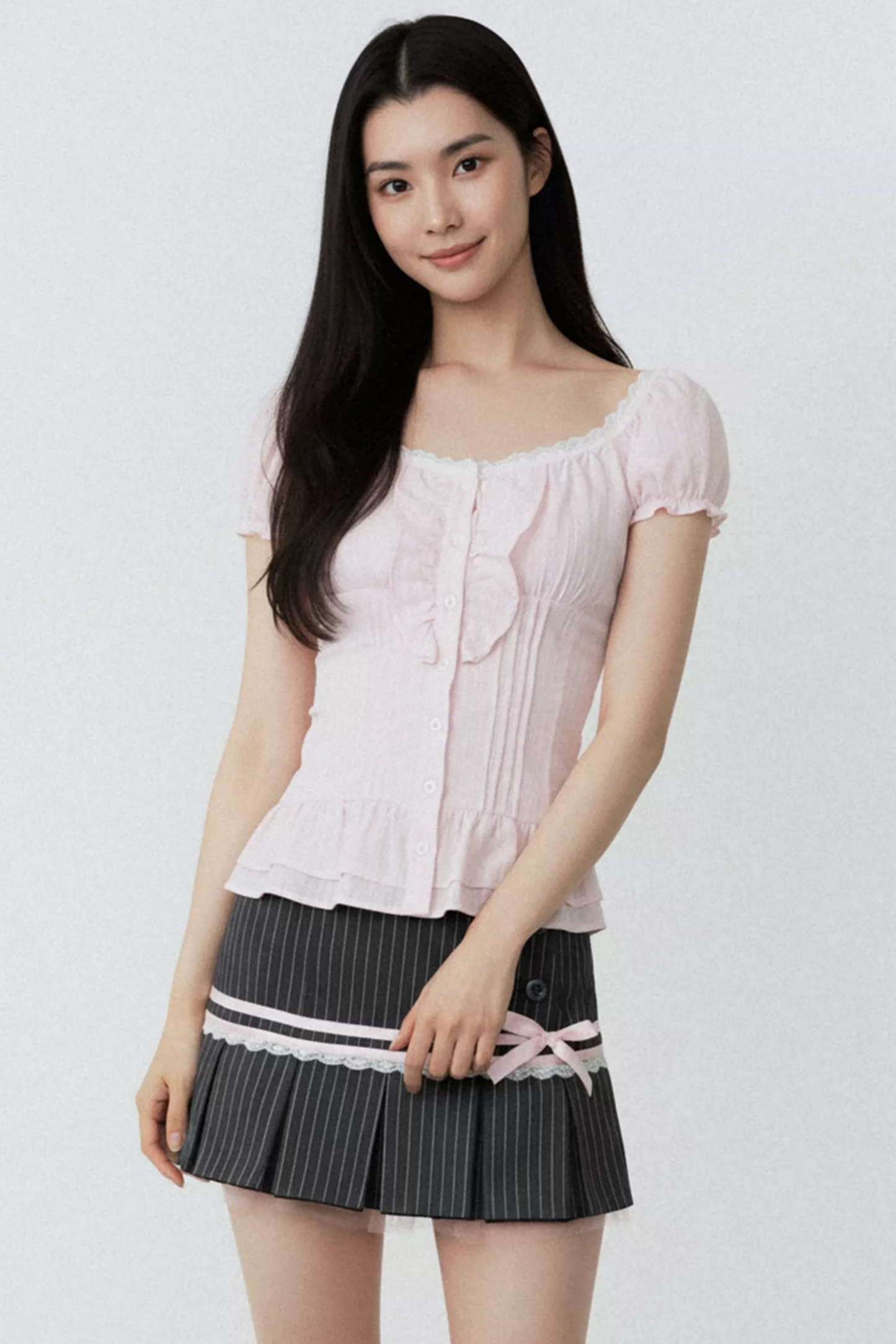 Conjunto de blusa con volantes rosa puro