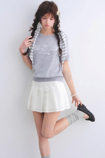 Jupe plissée en denim délavé blanc