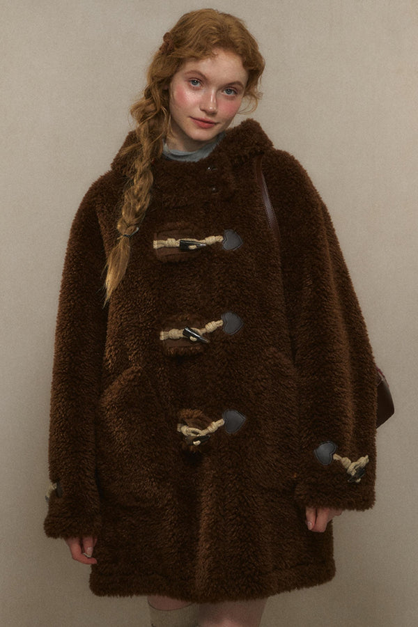 뿔 단추가 있는 루즈 핏 울 코트 