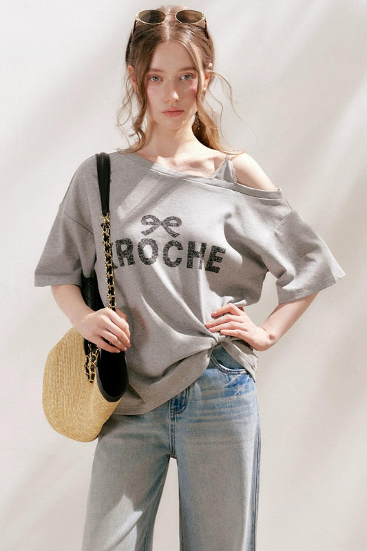 Blusa in pizzo francese con spalle scoperte