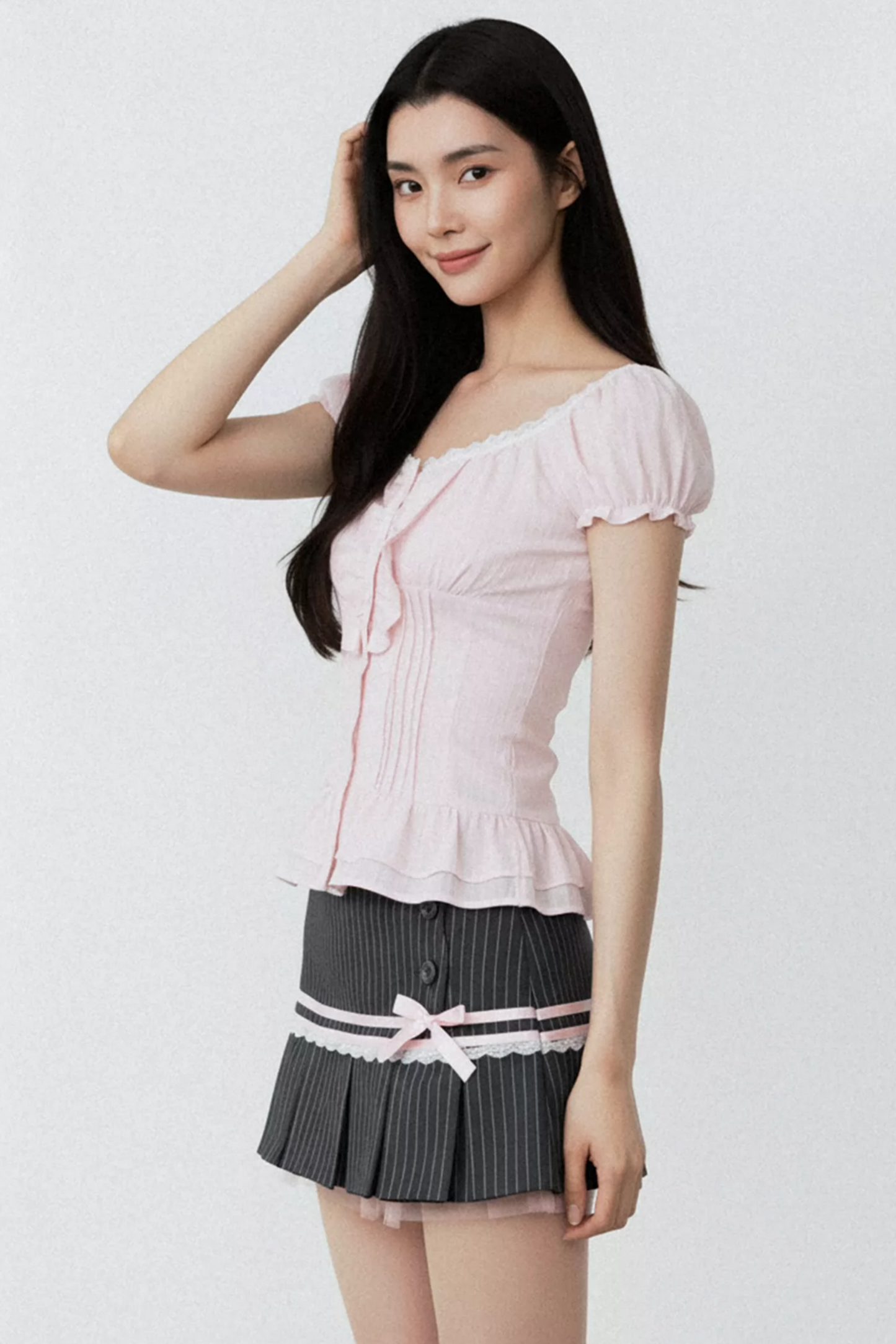 Conjunto de blusa con volantes rosa puro