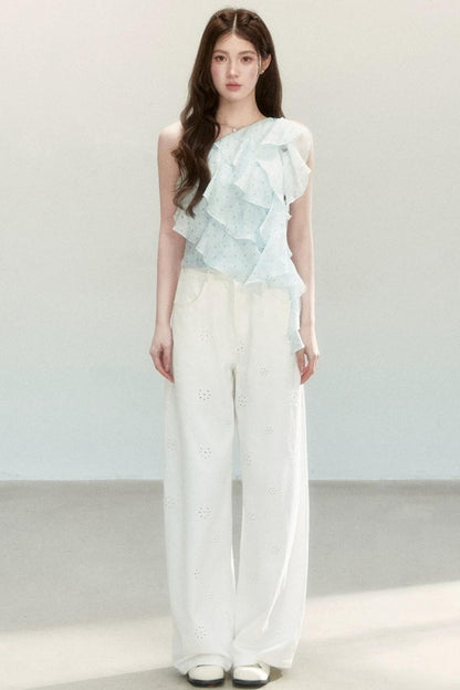 Blusa a pois in tessuto leggero con volant