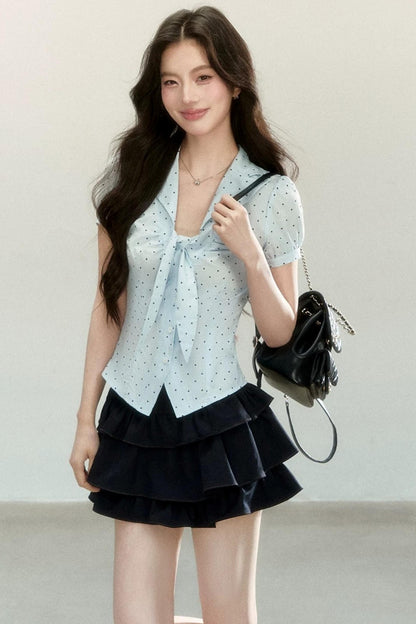 Blusa a pois con collo a fiocco