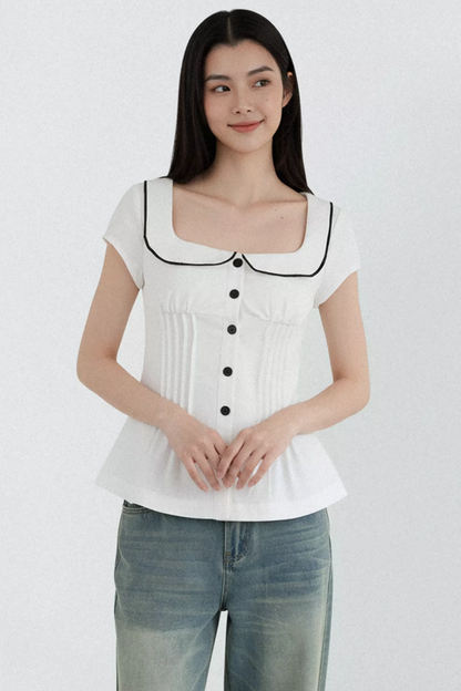 Blusa con cuello de muñeca con bloques de color